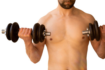 Fototapeta na wymiar a man with a bare torso of medium build raises his arms with dumbbells, the concept of sport and a healthy lifestyle