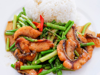 stir fried fish crispy and asparagus cooked rice on plate