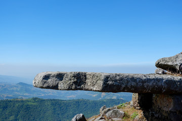 Rock on hill top mountain and blue sky background / Landscape view poin field stone