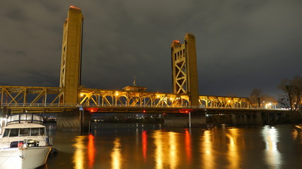 Sacramento tower bridge and river at night