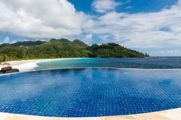 Round infinity swimming pool with ocean view