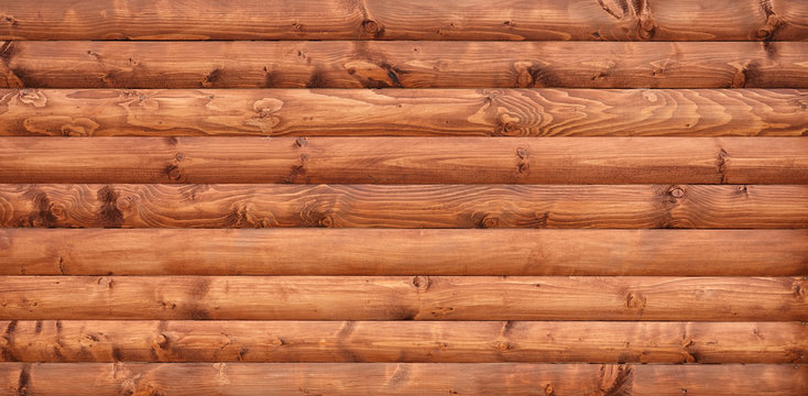 Wooden wall assembled of beams or logs