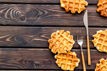 Traditional belgian waffles on served wooden table background top view mockup