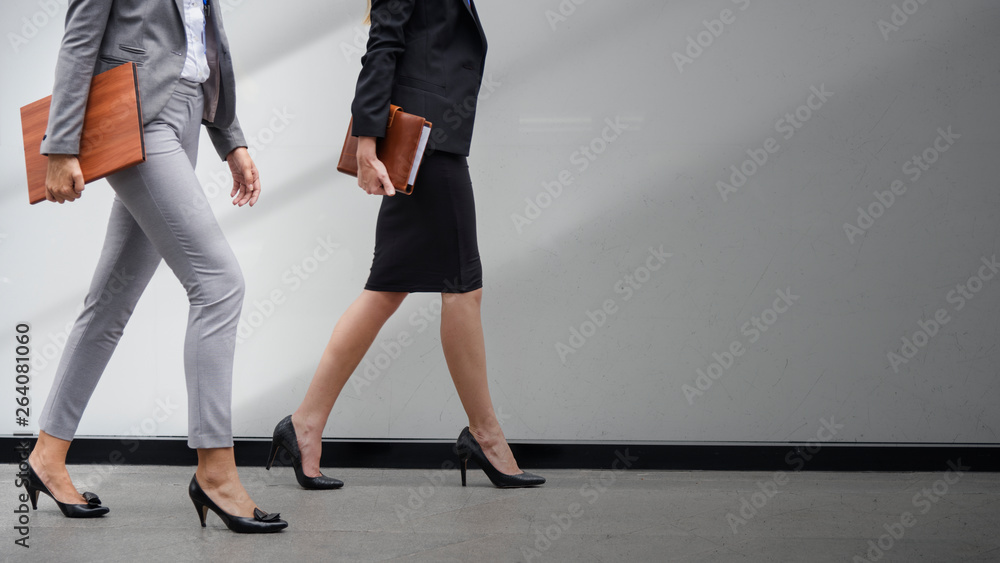 Wall mural Businesswomen walking together