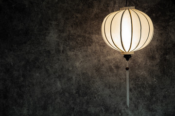 Vietnamese,r, Chinese white lantern spheric over vintage grunge concrete dark background with copy...