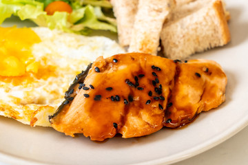 salmon teriyaki steak with fried egg and salad