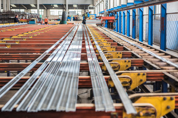 Naklejka premium Mechanical equipment and finished products in workshop of aluminium alloy products factory