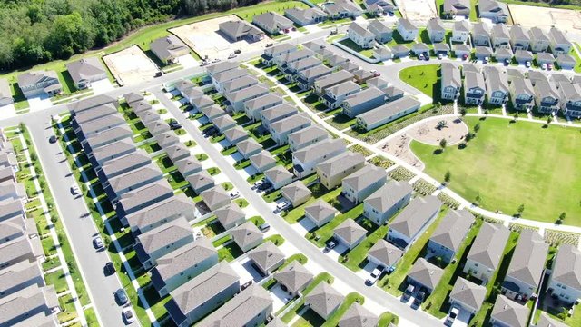 Flying over new cookie cutter homes, newly constructed neighborhood