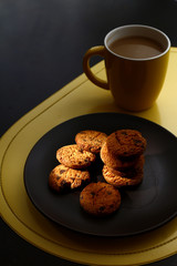 Chocolate cookies on a plate and coffee