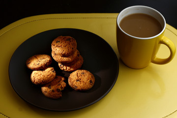 Chocolate cookies on a plate and coffee