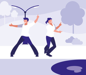 young dancers couple dancing in the park