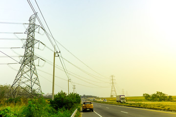 Landscape nature view with electricity pylon transmits to countryside, Electricity power line cross...