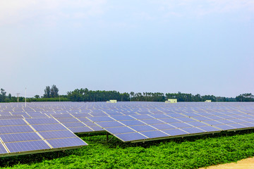 Solar power and photovoltaic panels under the blue sky white clouds.