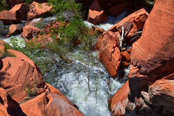 Views of Waterfalls at Gunlock State Park Reservoir Falls, In Gunlock, Utah by St George. Spring run off over desert erosion sandstone. United States.