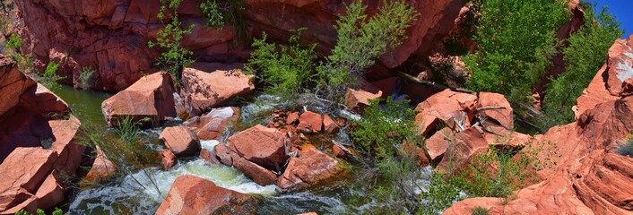 Views of Waterfalls at Gunlock State Park Reservoir Falls, In Gunlock, Utah by St George. Spring run off over desert erosion sandstone. United States.
