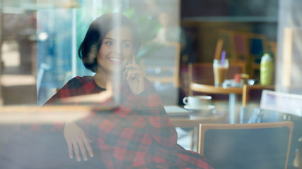 Positive woman talking on phone