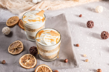 Layered mascarpone dessert with crushed vanilla biscuits and carame