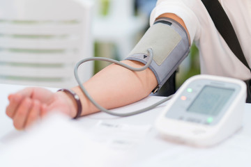 Doctor checking patient arterial blood pressure in hospital. Health care Concept - 264104862