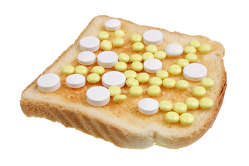 Dangerous food concept  - toast sandwich with  medical pills isoalted