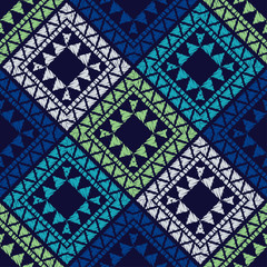 Fototapeta premium Ethnic boho seamless pattern. Ikat. Traditional ornament. Geometric background. Folk motif. Can be used for wallpaper, textile, invitation card, wrapping, web page background.