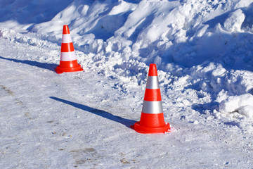 traffic cones on the snow