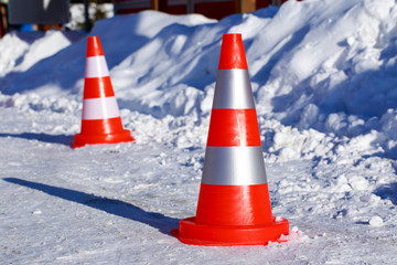 traffic cones on the snow