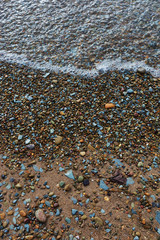 Water washing over rocks on the beach