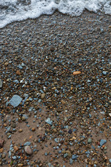 Water washing over rocks on the beach