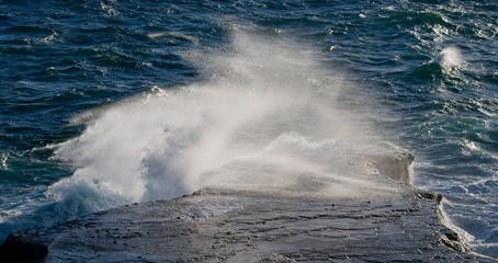 The coastline on the Peninsula Valdes. Waves crashing against the rocks. Argentina. South America