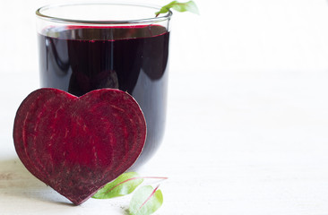 Healthy beetroot with heart shape and juice