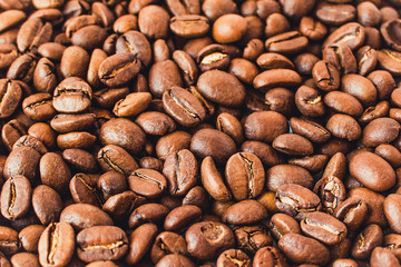  Background of coffee beans. Coffee is on the table