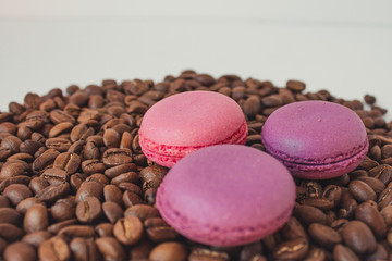  Sweets and coffee on a white background. Macaroons are coffee beans.