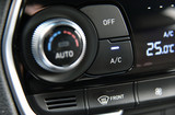 button for activating the air conditioners on the dashboard passenger car