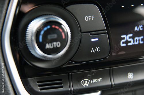 button for activating the air conditioners on the dashboard passenger car