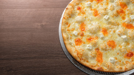 Pizza four cheese with copy space and tinted.
