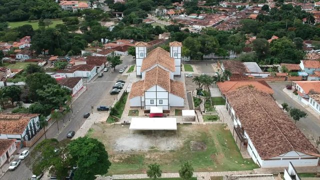 Drone footage of the downtown area of the city of Pirenopolis, Brazil, including aerial footage of a local church.