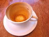 Empty Coffee Cup in Cafe on timber table