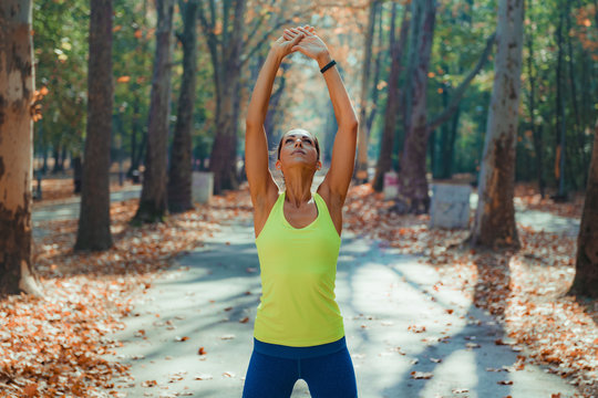 Woman Stretching in the Park.