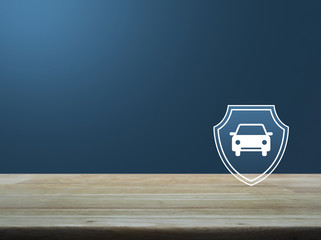 Car with shield flat icon on wooden table over light blue gradient background, Business automobile insurance concept