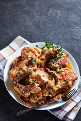 pork chops and hash brown on a plate