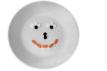 Pill smile on white plate