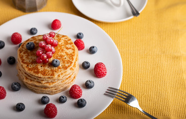 pancakes with raspberries and blueberries top view