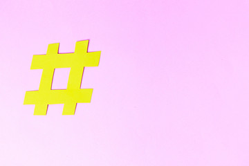 Hashtag sign isolated on background, close-up, copy space