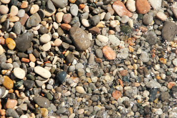 Small pebbles pebbles under the water surface photo background
