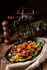 tender beef topped with various vegetables