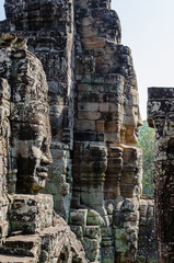 Smiling Faces of Bayon Temple in Angkor Thom is The Heritage of Khmer Empire at Siem Reap Province,...