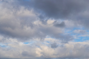 Clouds against the blue sky as a background