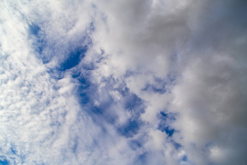 Clouds against the blue sky as a background