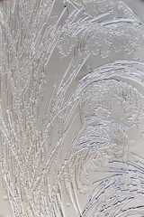 Snow patterns on glass as an abstract background