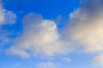 Clouds after rain before sunset as a background